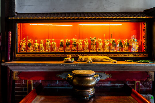 A cat takes a nap in a temple