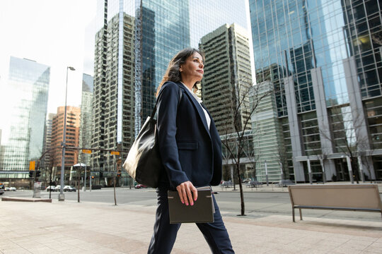 Confident Business Woman Walking Downtown
