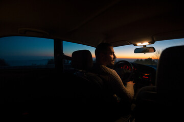 Driver inside car looking through the window