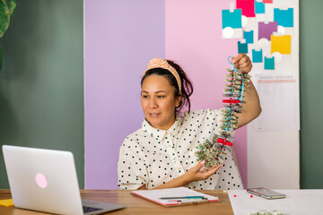 Woman showing money lei online