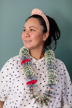 Woman wearing monei lei portrait