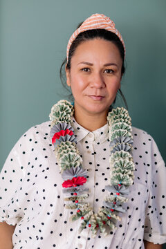 Woman wearing monei lei portrait