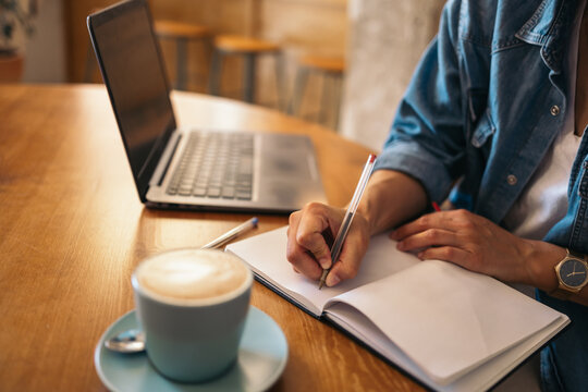 Freelancer working from a cafe - Powered by Adobe