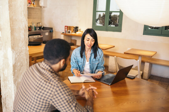 Business woman interviewing a candidate in an alternative workspace