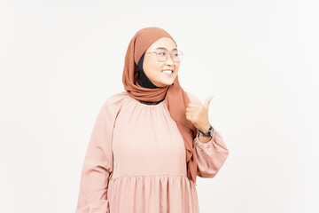 Presenting and Pointing Side Product Using Thumb of Beautiful Asian Woman Wearing Hijab