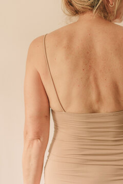Backside senior female body in underwear