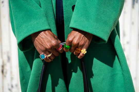 Male hands with fashion rings holding phone