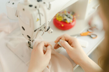 hands  seamstress working with sewing machine