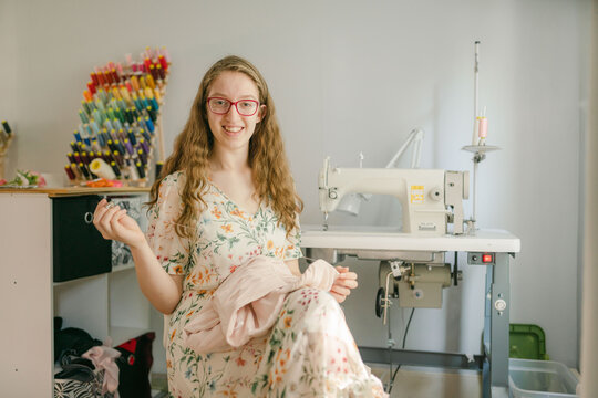 smiling  Young seamstress working