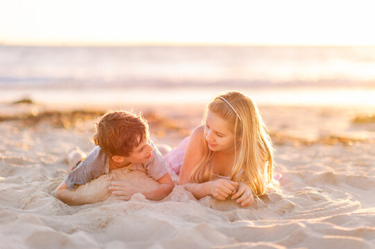 Kids Playing In Sand At The Beach