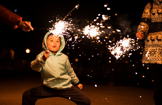 Kid play firework happily