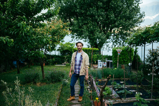 Man posing in his garden