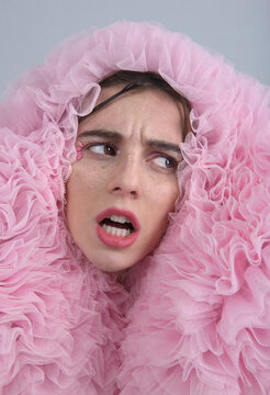 Cute woman cover in pink ruffle 