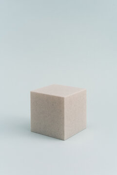 3D Printed Off-White Cube On The Blue Background