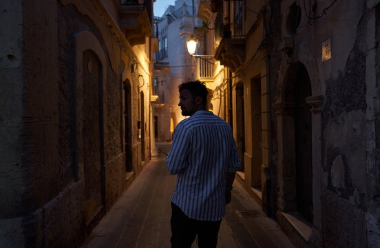 A man in the dark - Powered by Adobe