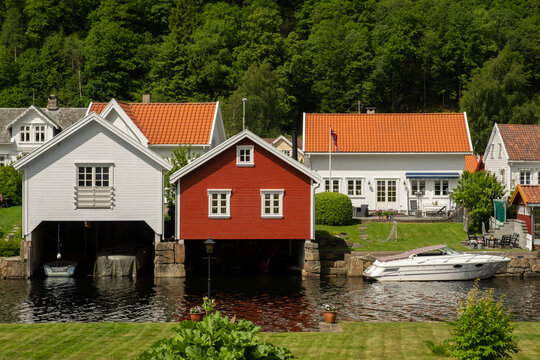 Coastal town. Red and white garages for boats  in Norway
