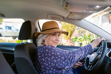 Senior woman driving car