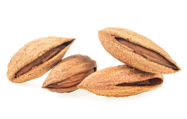 Heap of almond nuts in shell isolated on a white background