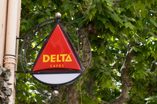 Delta cafe sign brand and text logo on coffee shop of coffee makers restaurant in city street