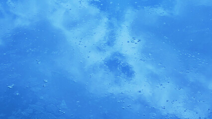 A photograph of a blue sky reflected from the water. many blurry white clouds on light blue background blue white cloudy design art pattern summer water nature artwork landscape texture wallpaper thai