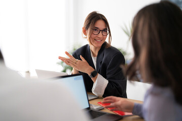 Project leader discussing data with coworker