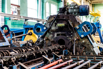 Machine for induction heating of metal. A metal rod heated in an induction furnace. Hot metal...