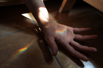 Rainbow light in a hand