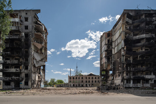 Facade of a bombed-out apartment building.