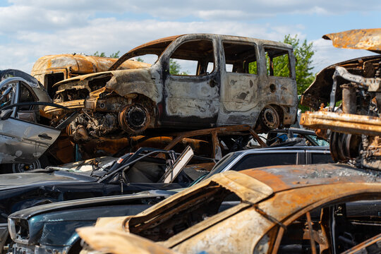 Cemetery of burnt rusty cars.