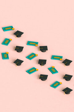 rows of graduation cap and diploma