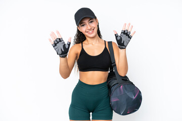 Young sport woman with sport bag isolated on white background counting ten with fingers
