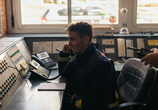 Firefighter on a phone call in the fire house