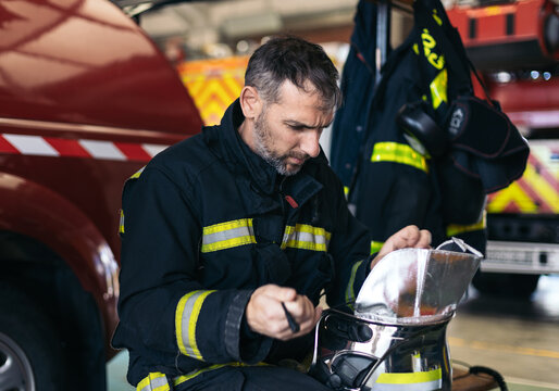 Firefighters putting on uniform
