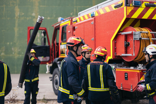 Firefighters working on an intervention with the fire truck