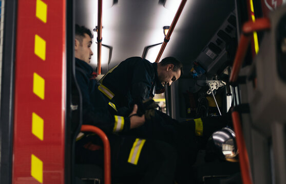 Firefighters getting off the fire truck