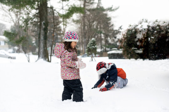 Happy kids playing in snow