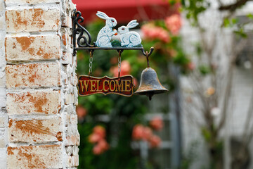 Welcome sign on the brick wall