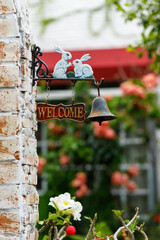 Welcome sign on the brick wall