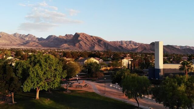 Vertical reveal of the last Vegas western suburbs to the Red Rock mountains