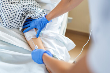 Nurse giving intravenous analgesic