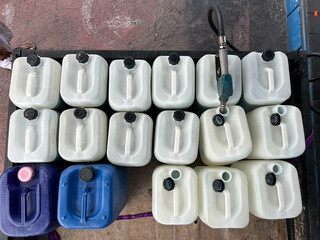 Filling gas fuel to plastic canisters at gas station can