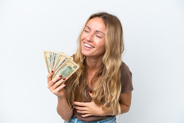 Young Russian woman taking a lot of money isolated on white background smiling a lot