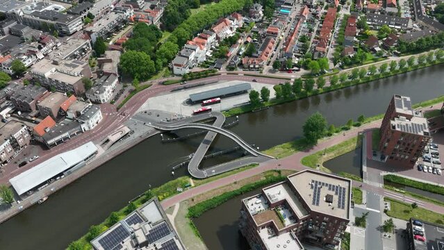 Purmerend, The Netherlands. The Melkwegbrug arch and swing bridge in Purmerend over the Noordhollandsch Kanaal. Aerial drone view