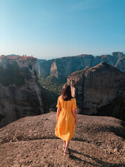beautiful woman in yellow dress at greece thessaly mountains