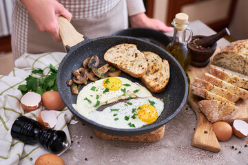 Close up view of the fried egg on a frying pan