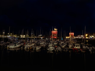 La Rochelle, France June 2022. Night photo of the port of La Rochelle, light illumination on two...