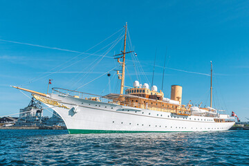 Royal Yacht Dannebrog, old ship of the Danish Queen in the harbour, serves as the official and...