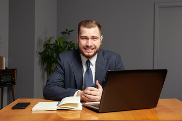 Feeling sick and tired. Frustrated young businessman working in office