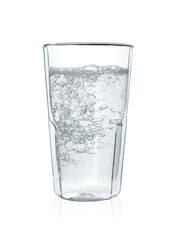 Pouring soda water into glass on white background