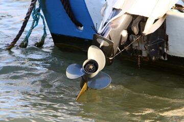 Motor and propeller of a motorboat.